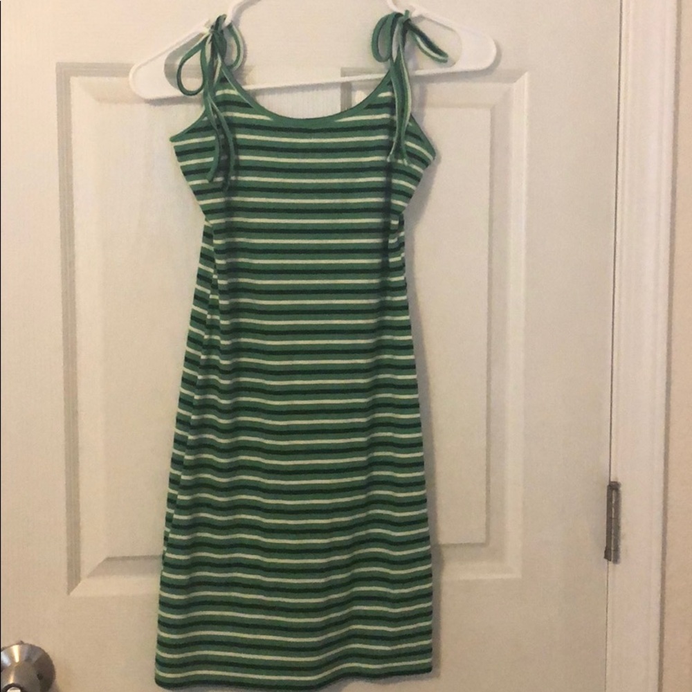 Green dress with black and white stripes